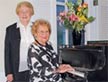 Emily Remington, seated, founder and guiding light of the Remington Concert Series, enjoys a musical moment with her friend, Annabelle Jenkins.